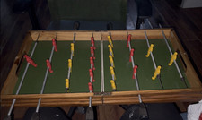 Vintage Wooden Tabletop Foosball Game with Red and Yellow Players