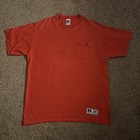 Red Russell Athletic men’s T-shirt with short sleeves, front pocket, and “Made in USA” label on left chest.