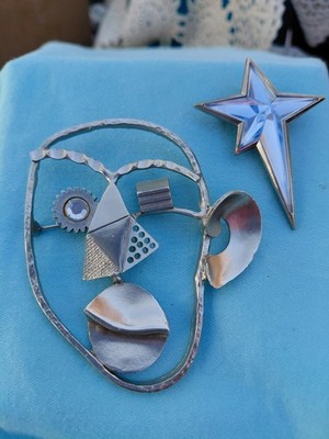 Vintage Silver tone Picasso looking face and silver Star pin/pendant