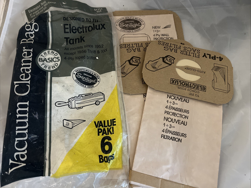 Four beige Electrolux Trend Basics vacuum filter bags with black circular logos and red “VALUE PAK!” text on front.