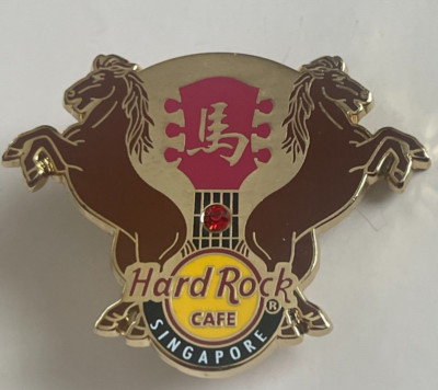 hard rock cafe pin with two horses from singapore