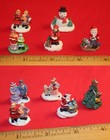 Christmas Village Lot of 10 Figures - 12 People, Santa, Tree, Dog & Snowman — photo 1