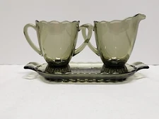 Three Piece Ruffled Smoke Glass Footed Creamer, Sugar Bowl And Tray Set   