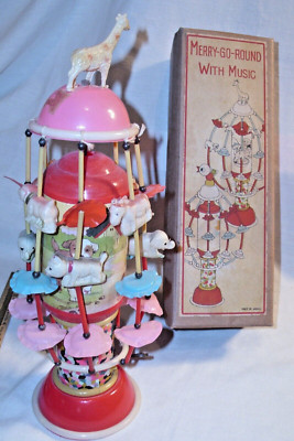 MERRY-GO-ROUND WITH MUSIC CELLULOID WIND UP TOY BOXED JAPAN WORKS