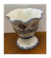 NICE WHITE WITH BLUE TRIM AND LOTS OF BIRD HOUSES AROUND THE FENCE