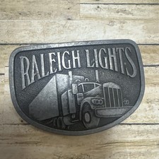 PRE OWNED BELT BUCKLE RALEIGH LIGHTS SEMI TRUCK LONG HAUL SMOKES 18 WHEELER BB11