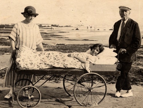 YOUNG BEDRIDDEN WOMAN AT THE BEACH : MOBILE HOSPITAL BED : SPANISH FLU - Picture 2 of 5