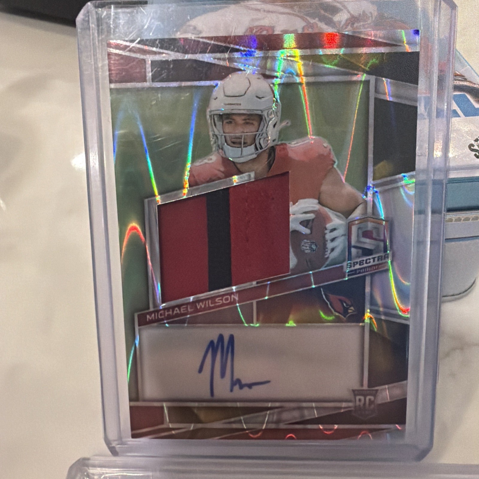 2023 Panini Spectra - Rookie Patch Auto Michael Wilson #227 Supernova Prizm /70