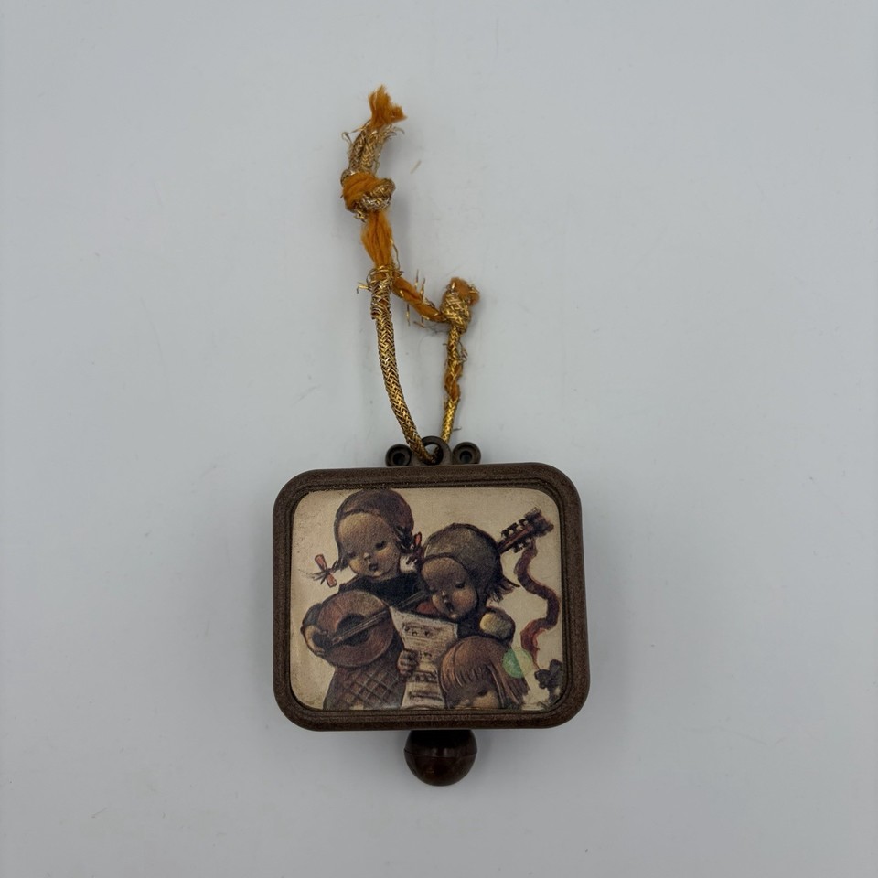 A 1960s Hummel pull-string ornament that plays Edelweiss — tiny, charming, and works after 60+ years, which is the whole point of buying vintage.