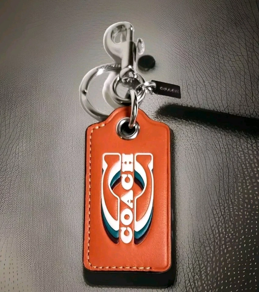 Llavero abridor de botellas Coach con sello plata naranja brillante cuero nuevo con etiquetas Foto 2 de 4