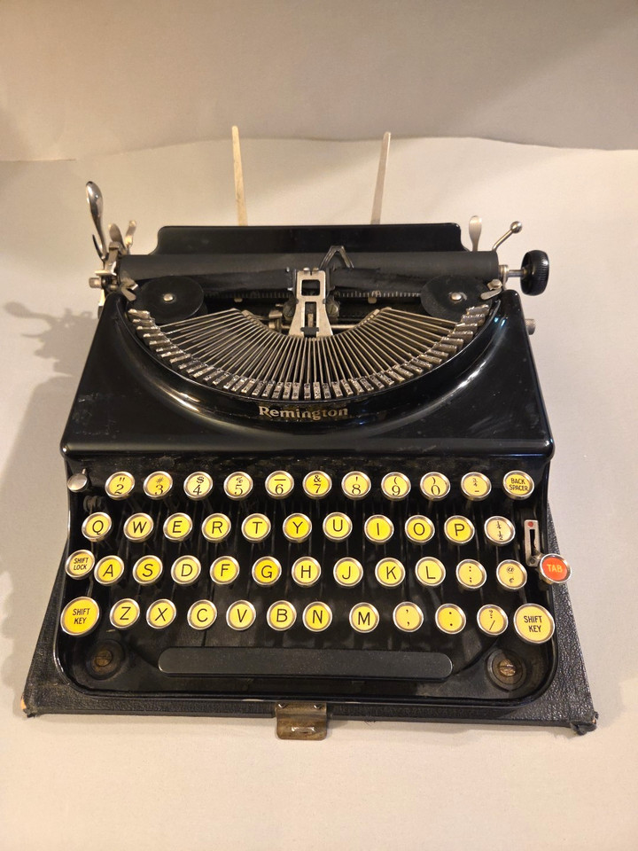 A 100-year-old fully functional Remington typewriter with all keys working — raw industrial charm with zero cover to hide its beautiful exposed mechanics.