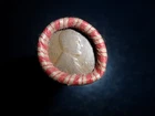 ROLL OF UNSEARCHED WHEAT PENNIES WITH 1912 AND A 1952D PENNY ON THE ENDS.