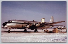 Universal Airlines Douglas DC-7 Winter Scene Aircraft Postcard by Bill Thompson
