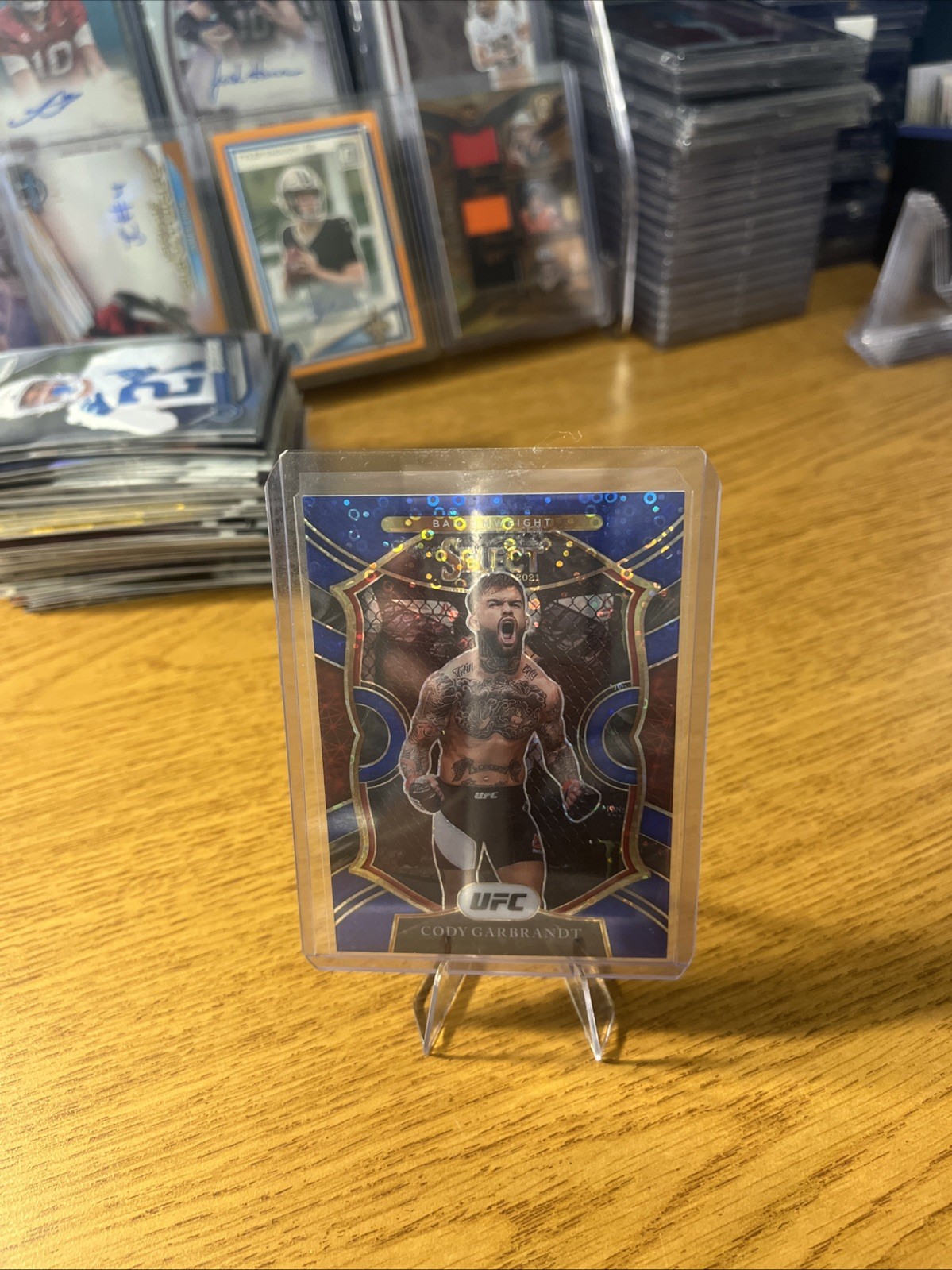 2021 Panini Select UFC - Concourse Cody Garbrandt #20 Blue Disco Prizm /99