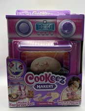 Cookeez Makery Cinnamon Treatz Oven Playset, "bakes" a surprise plush pet.