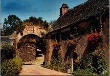 Brittany in Colours Flower bedecked houses at entrance to town C1980s Postcard