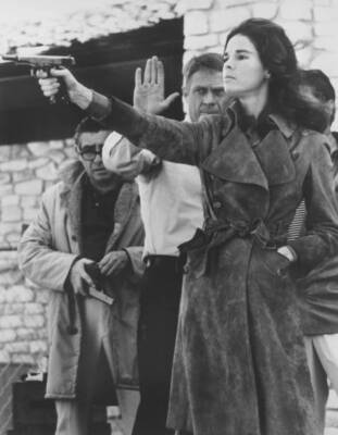 Steve McQueen helps Ali MacGraw get in some target practice during- Old Photo