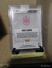 2026 Panini Instant FIFA World Cup #190 Unai Simon Spain card with stats, red accents, and “Ships ASAP” text.