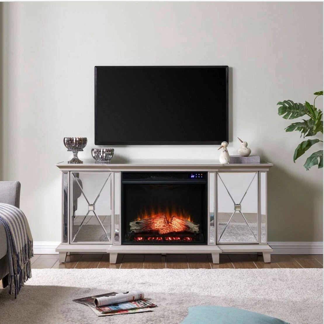 Mirrored entertainment center with fireplace outlet