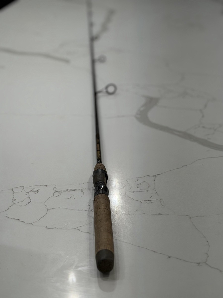 The item in the image is a G. Loomis Bronzeback SMR811S-SP fishing