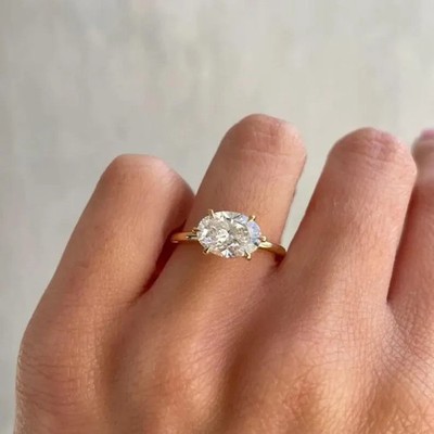 2.50 CTW Oval Cut VVS1 Moissanite East - West Ring In 14k Yellow Gold Plated