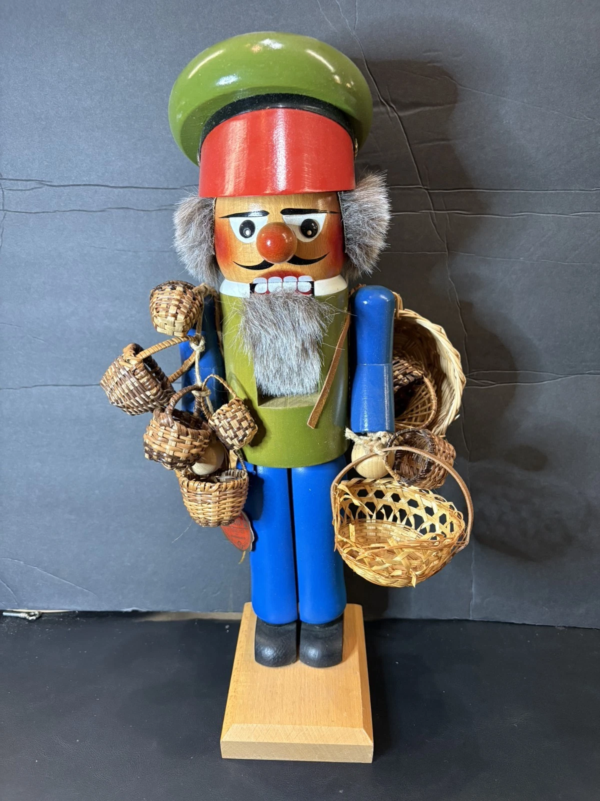Steinbach BASKET VENDER Nutcracker many tiny baskets S617- 15.5"