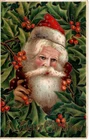 ANTIQUE CHRISTMAS Postcard    SANTA CLAUS, RED AND GOLD SUIT, LOOKING THRU HOLLY
