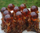 Wholesale Baltic Amber Figurine Sphynx Cats holding Amber Ball with inclusion