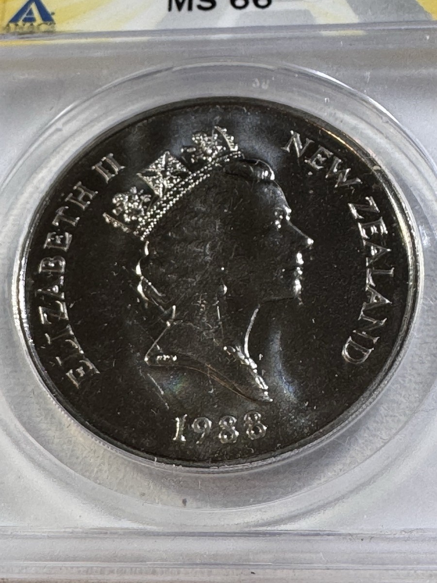 1988 New Zealand 1 Dollar Graded MS 66 by ANACS Yellow Eyed