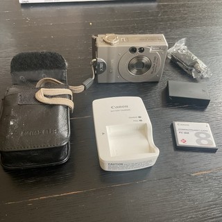 Canon Power Shot S100Digital ELPH Camera With Battery Charger CF Card Cables
