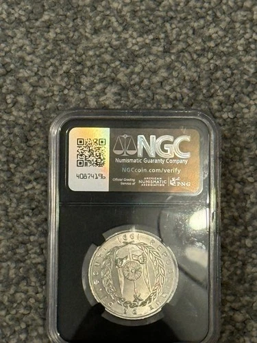 a 1991 Djibouti 5 Franc coin, graded and encapsulated by NGC (Numismatic Guarant