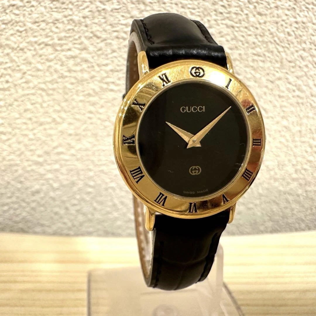 MONTRE GUCCI 3000,2,L CADRAN OR NOIR VINTAGE FABRICATION SUISSE QUARTZ NEUVE   bracelet