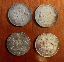 AUSTRALIA  1917  1 SHILLING SILVER COINS, XF to ALMOST UNCIRCULATED, LOT OF (4)