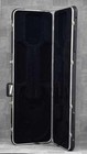 Black ERNIE BALL MUSICMAN STINGRAY used ash body guitar with maple neck and hard shell case.