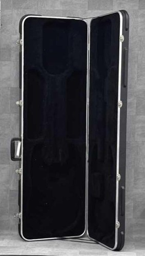 Black ERNIE BALL MUSICMAN STINGRAY used ash body guitar with maple neck and hard shell case.