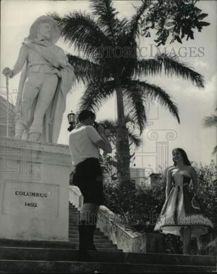 #ad 1963 Press Photo Woman gets her picture taken near a statue in Nassau Bahamas $24.99
