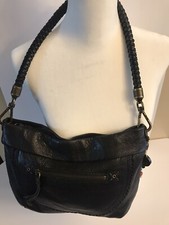 The Sak Black Pebbled Leather Hobo Bag with Braided Strap with beaded tassel