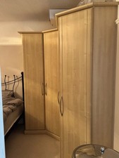 Corner Wardrobe plus single and double robe plus angled robe. light wood finish