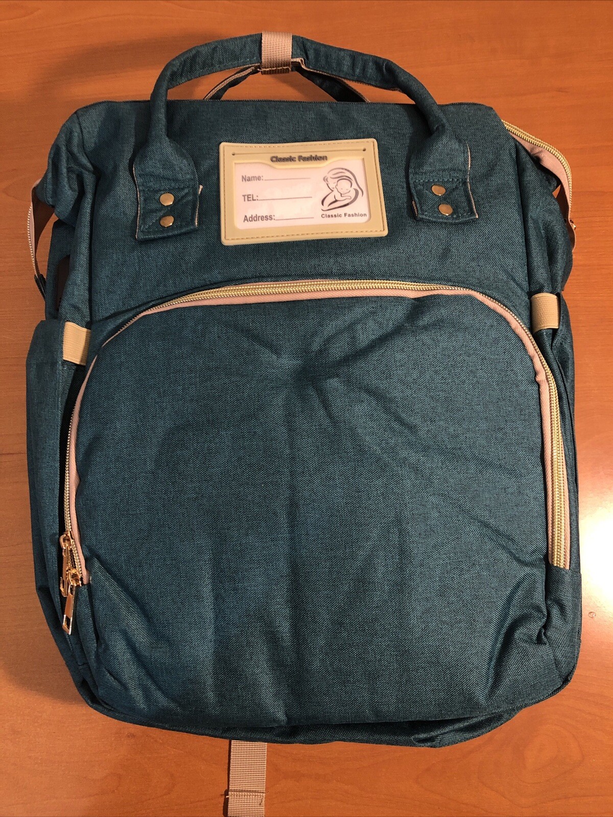 Waterproof Green Diaper Backpack with Changing Station and Stroller Straps-image