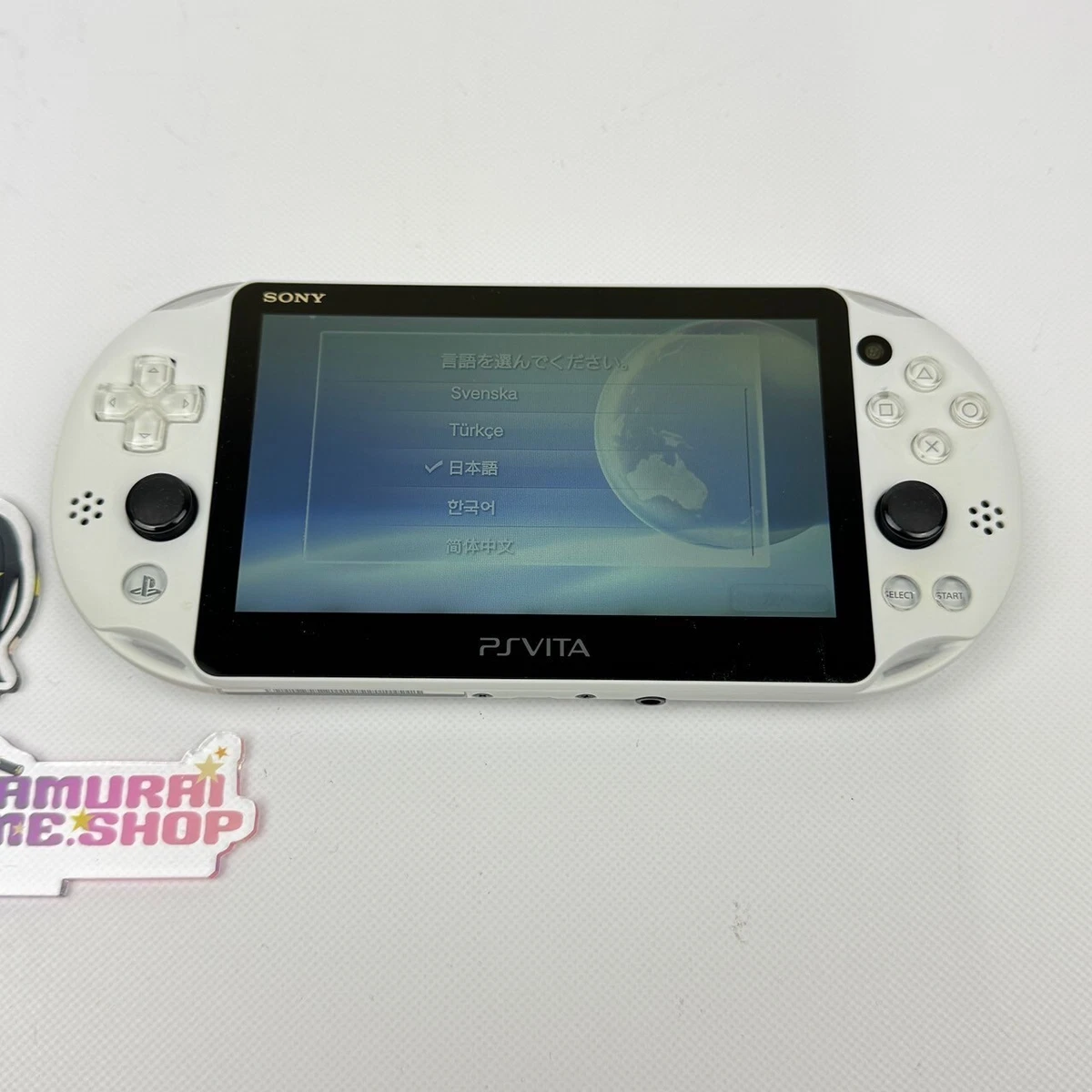Console Sony PS Vita PCH-2000 - Citron Vert/Blanc - Avec 2 Jeux - Occasion (Chargeur Non Fourni)