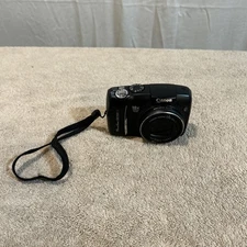 Canon PowerShot SX120 10X Optical Zoom 9.0 Megapixel Digital Camera And Case