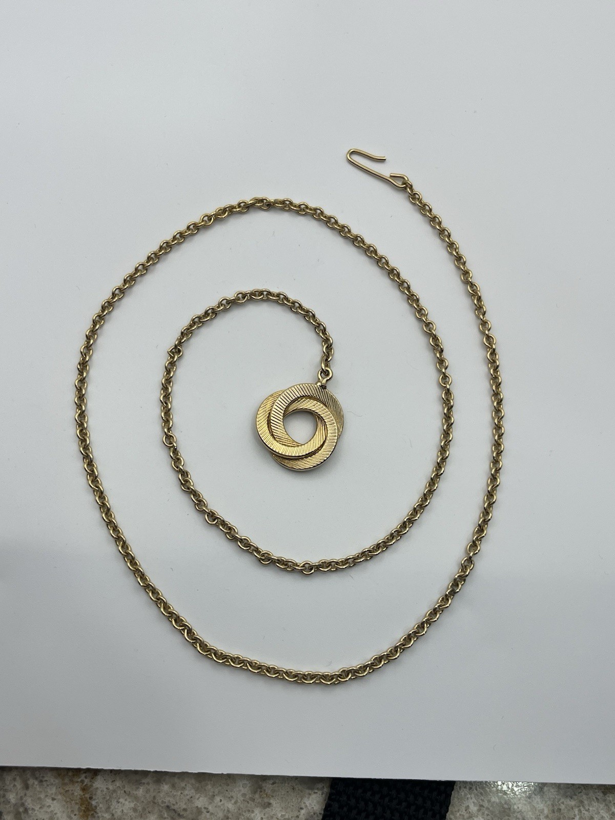 Engine turned gold tone triple interlocking circl… - image 10