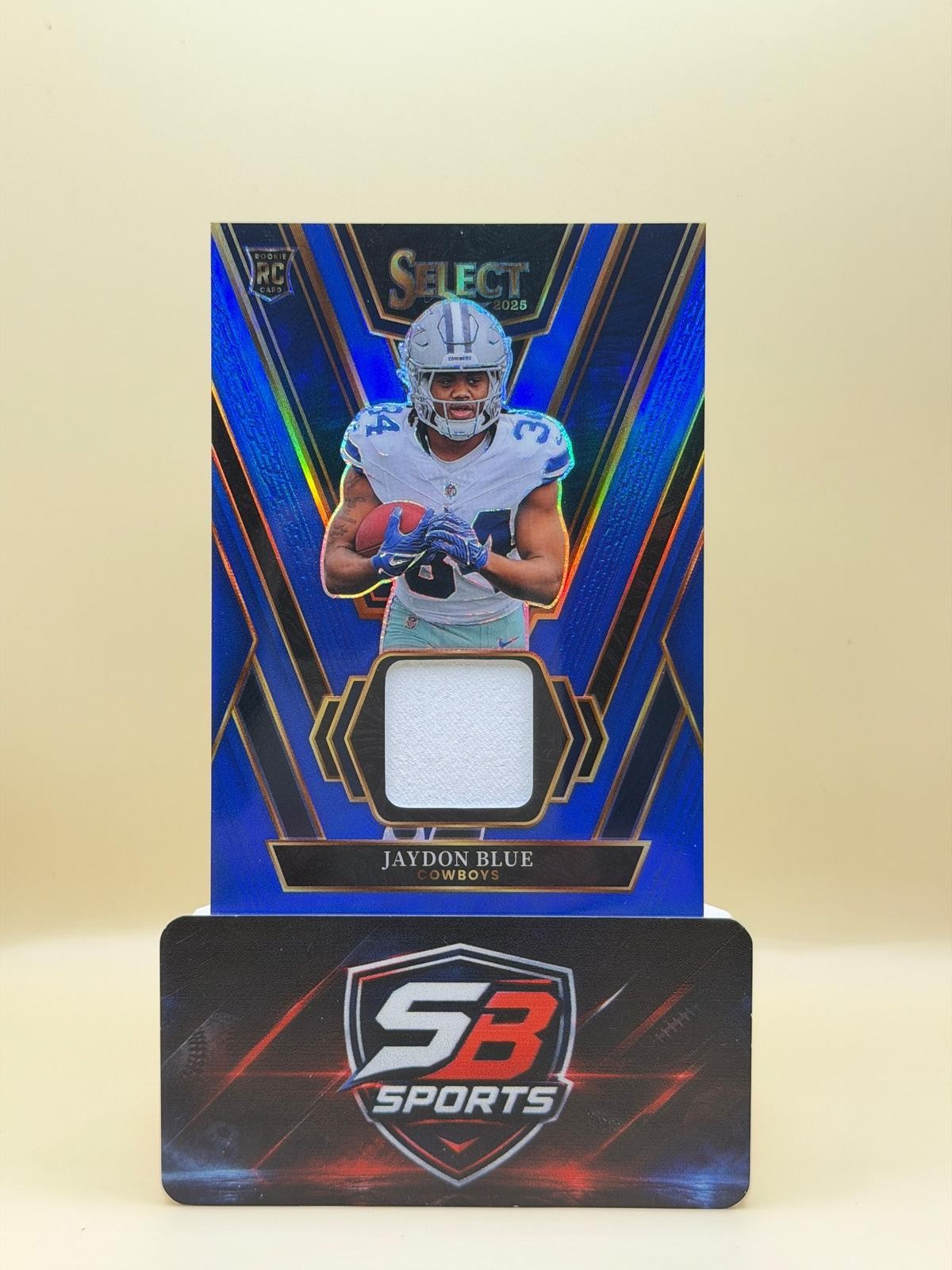 2025 Panini Select #RSW-JBE Jaydon Blue Rookie Swatches Blue Prizm COLOR MATCH!