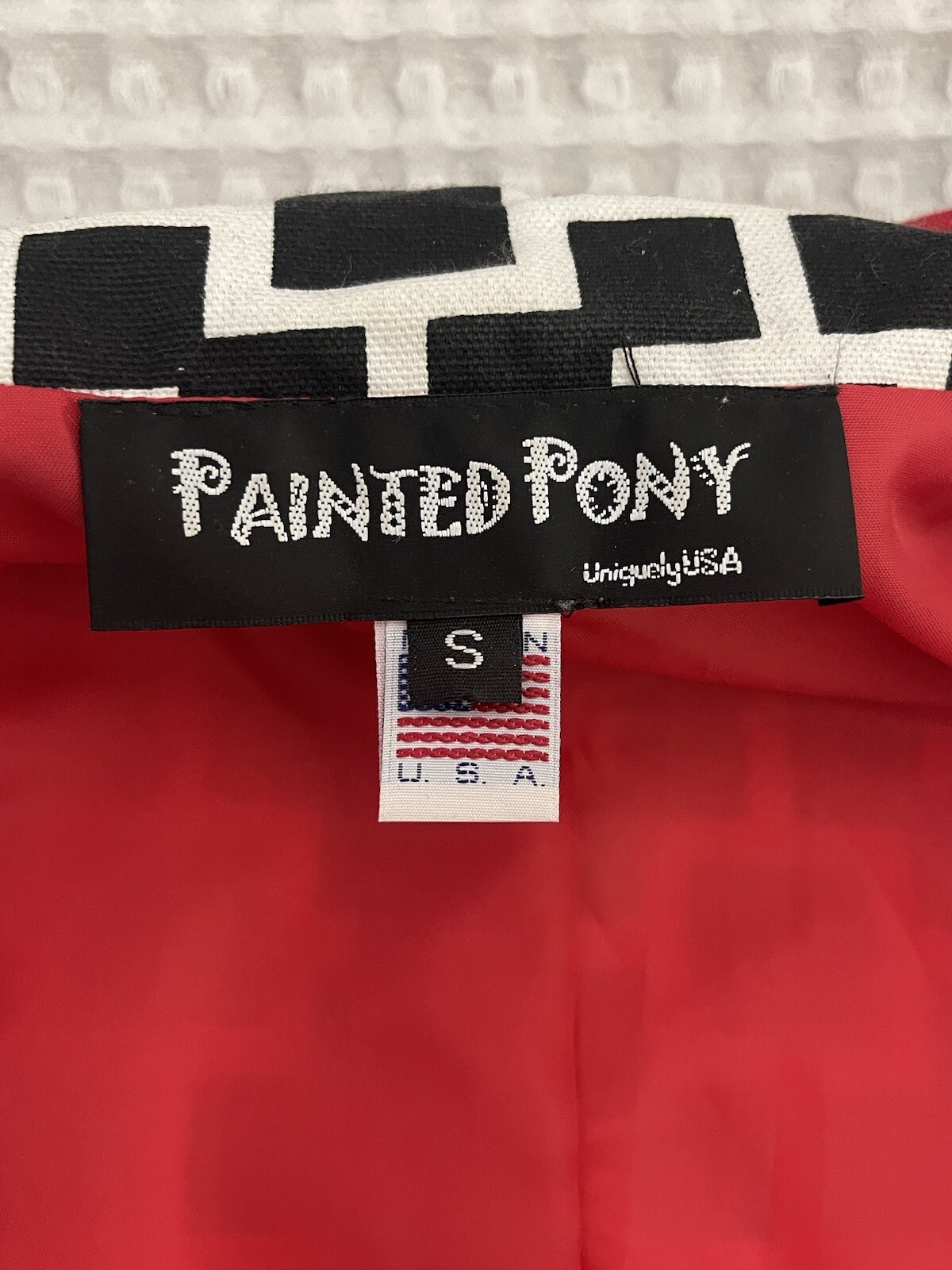 Giacca anteriore aperta pony dipinta donna nero bianco con fodera rossa taglia small