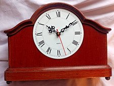 Large vintage wooden cased wind up clock been converted to a quartz movement.