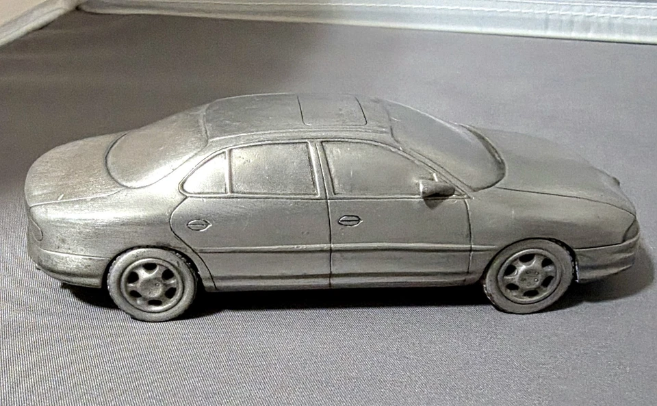 Estaño Miniatura Oldsmobile Motor Co Modelo Años 90 (Intriga) Foto 2 de 4