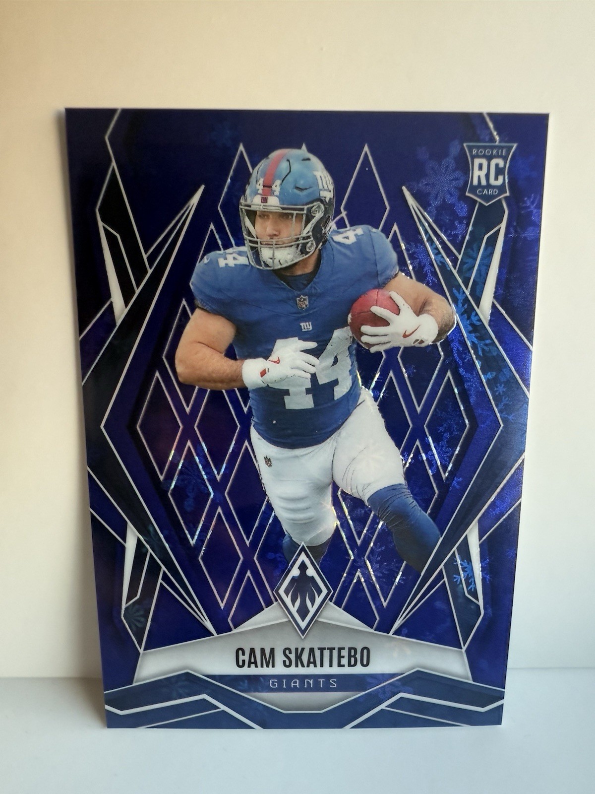 2025 Panini Phoenix Holiday #168 Cam Skattebo Winter Blue #/199