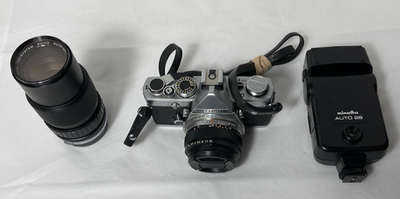 Olympus OM-1 SLR Film Camera with 28mm and 75-150 Zuiko Lenses