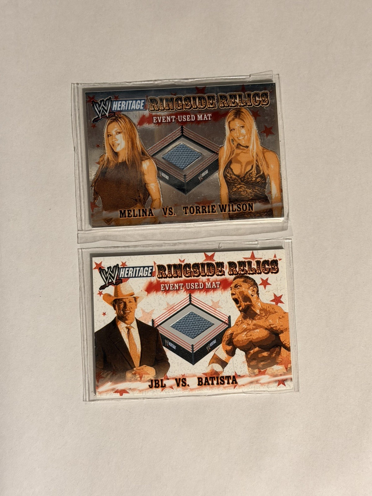 2005 Topps WWE Heritage Ringside Relics 2 Card Lot Event Used Mat Batista