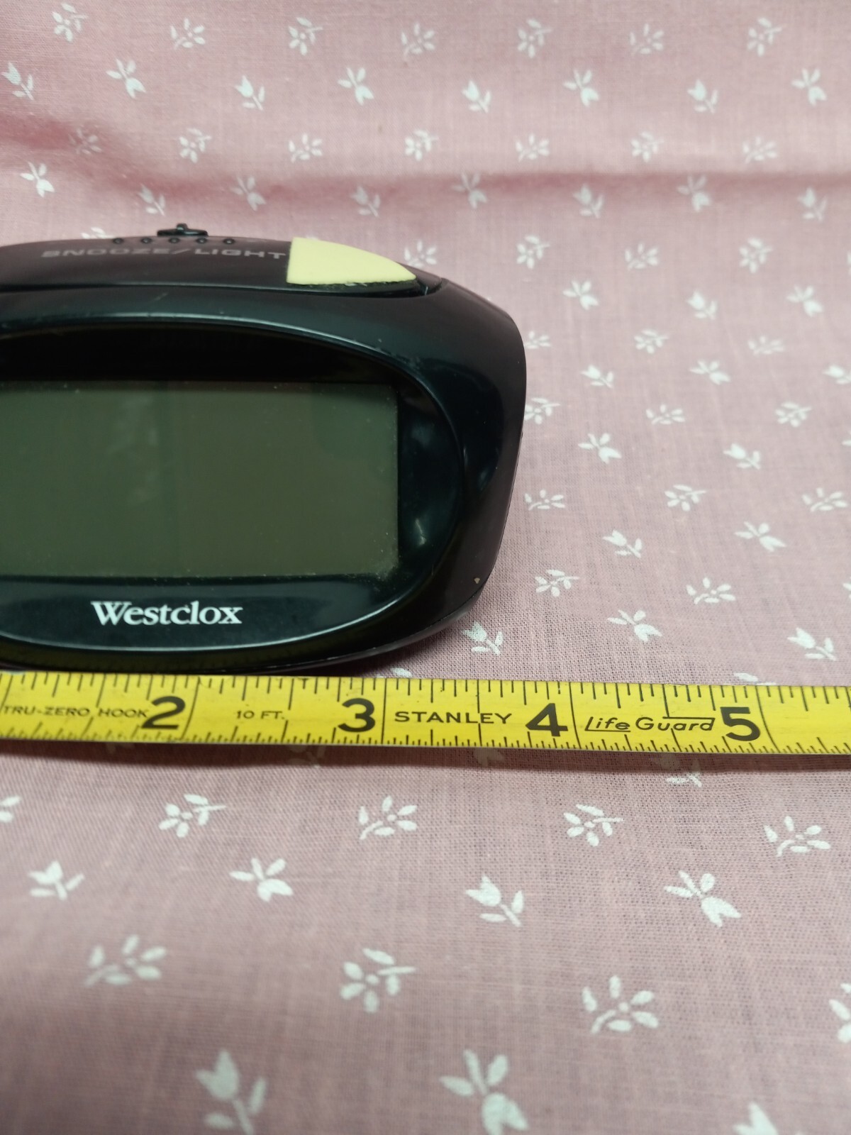 Westclox battery operated alarm clock with light portable space saving